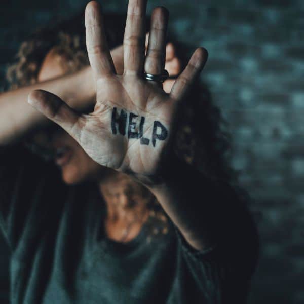 Substance_Abuse Lady holding her hand out with 'Help' written on it