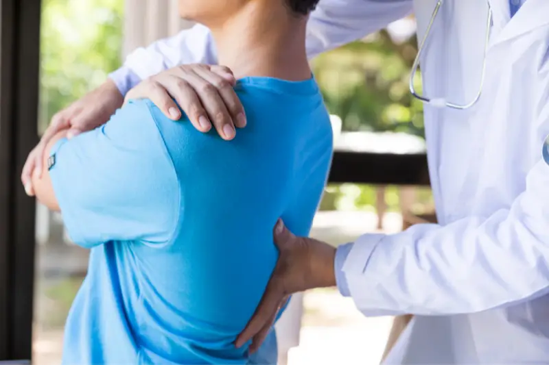 Physiotherapists_training_in_back_pian1 Physiotherapists helping a paitent with back pain